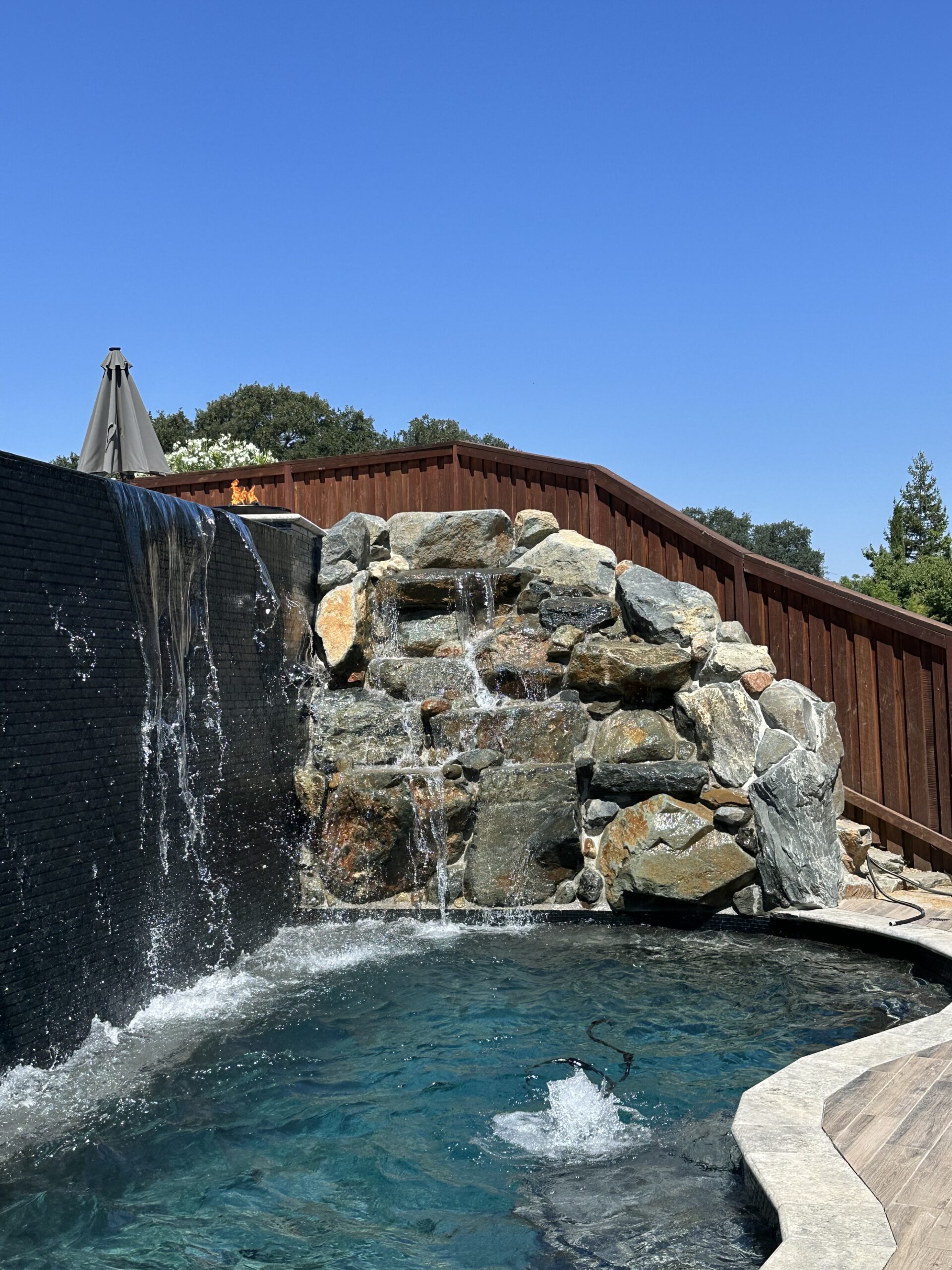 Rock sculpture and waterfall pool feature