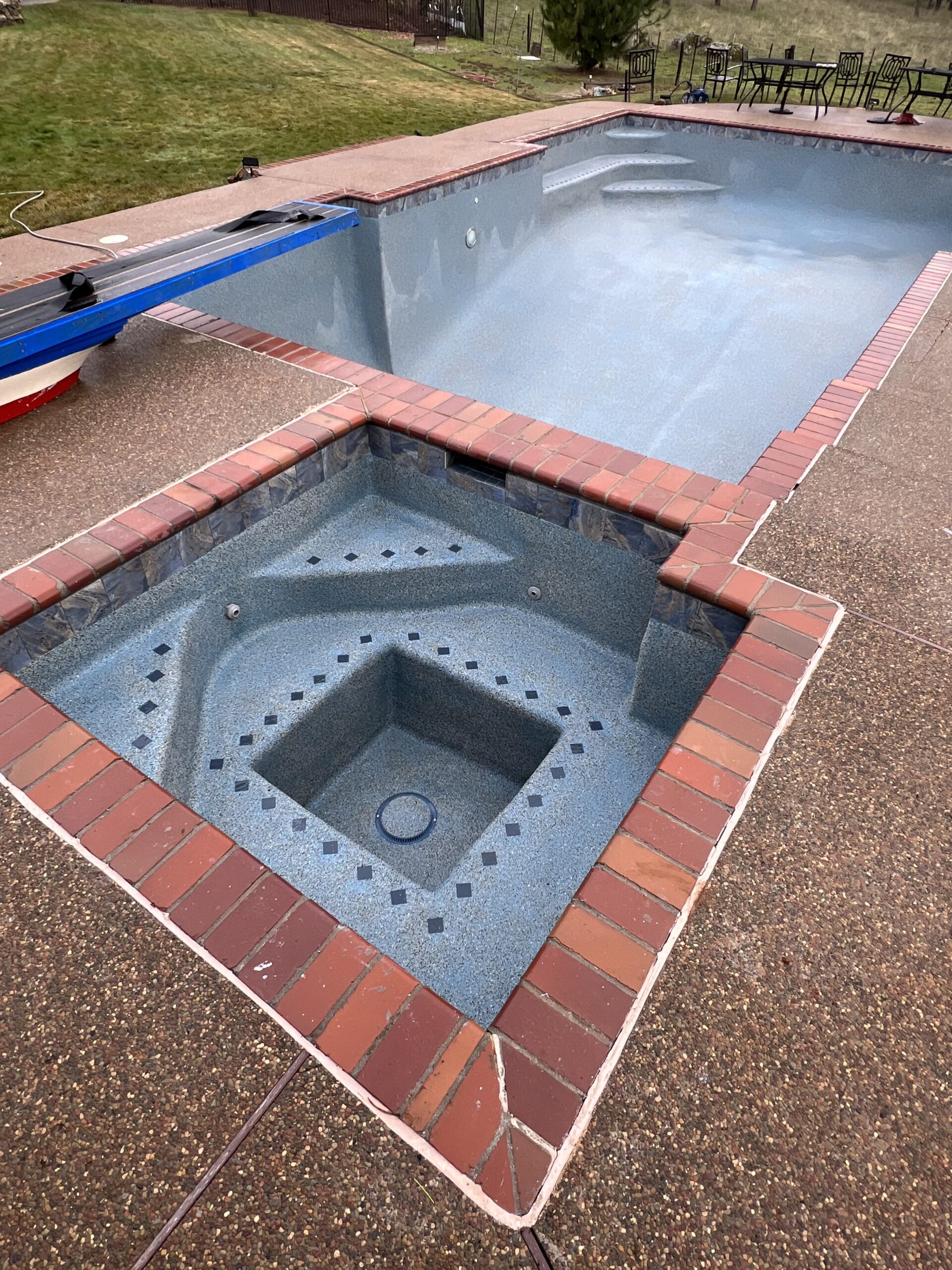 Finished pool plaster remodel with new fittings and drain covers