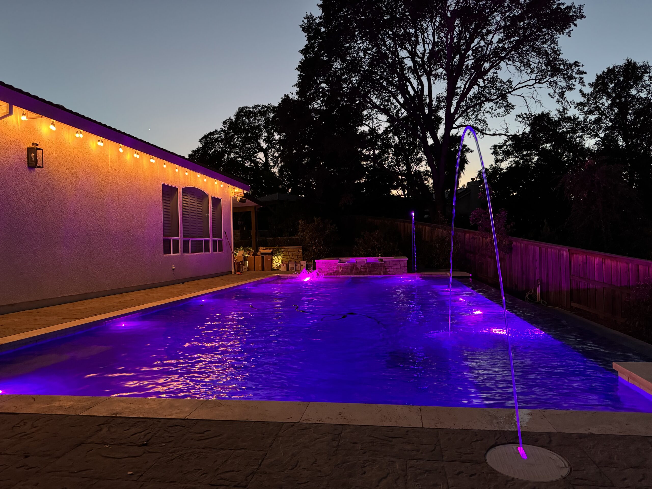 Gunite backyard swimming pool with lighting in Sacramento, CA