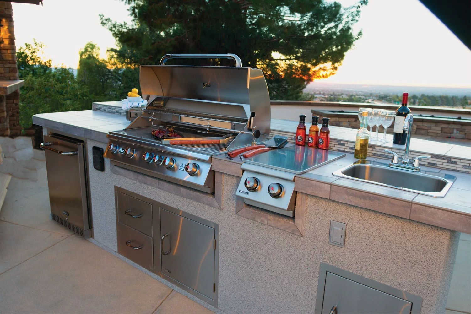 Luxury outdoor kitchen with Bull BBQ grill in a Sacramento backyard