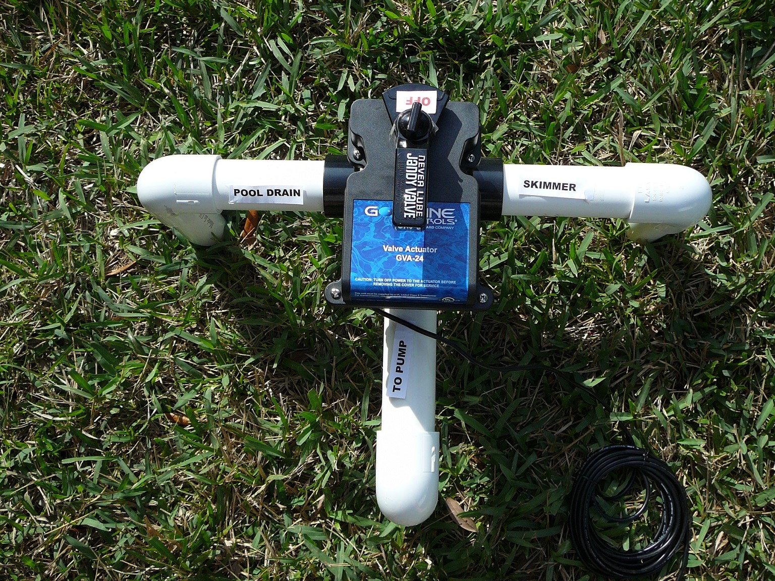 Pool plumbing valves and automation panel during inspection