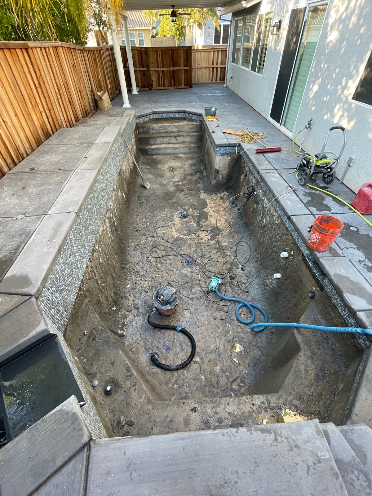 Drained swimming pool before plastering and resurfacing