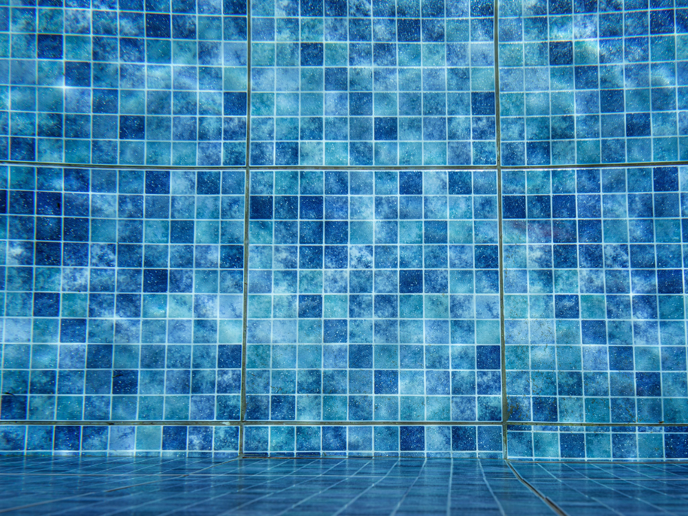 Clean swimming pool with bright tile and clear blue water
